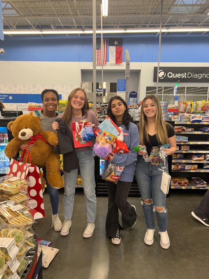 Jazlyn, Carys, Natalie, and Sydney have a great time shopping for the toys their angels requested.