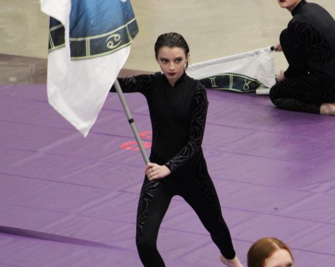 Adele Myers focuses on her timing during the performance of Superstitions at the Color Guard fundraiser. 