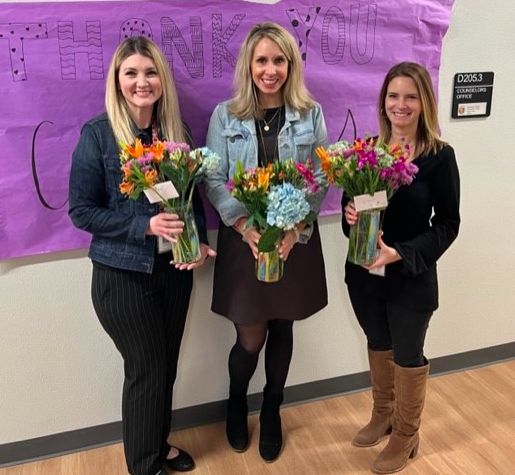The counselors received beautiful flowers from the  hospitality team. Not pictured is Mrs. Cantrell, the academic and career advisor.