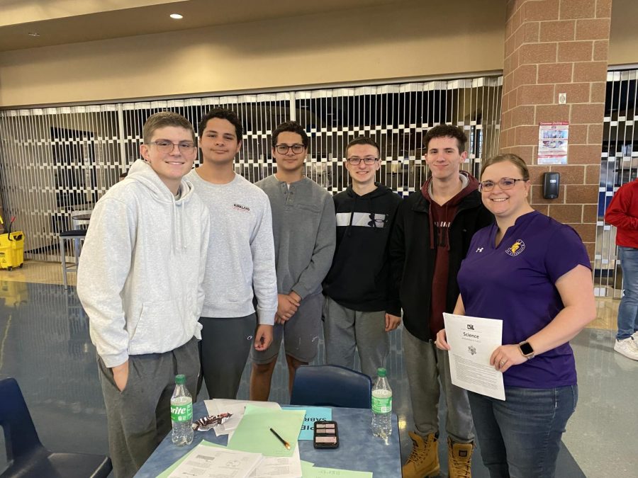 Members+of+the+UIL+Science+team+and+their+coach%2C+Mrs.+Myers%2C+go+over+questions+from+the+test+taken+at+the+Johnson+Invitational+meet.